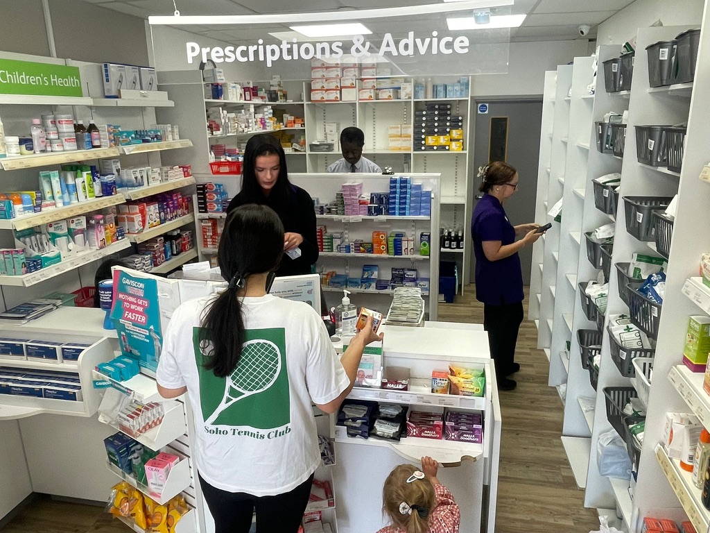 Southdowns Pharmacy team serving customers in branch